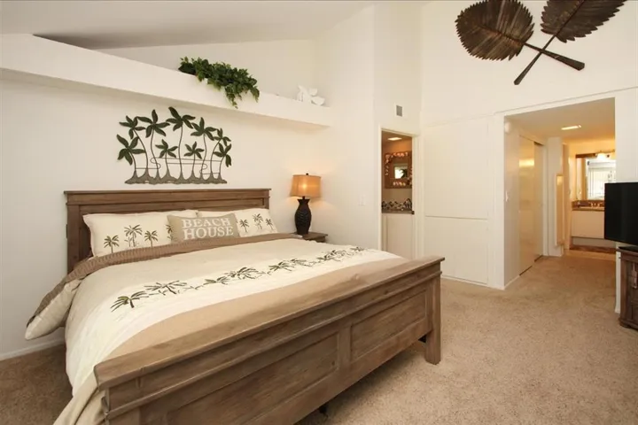 Master bedroom offers sliding doors to the large outdoor sunny deck.