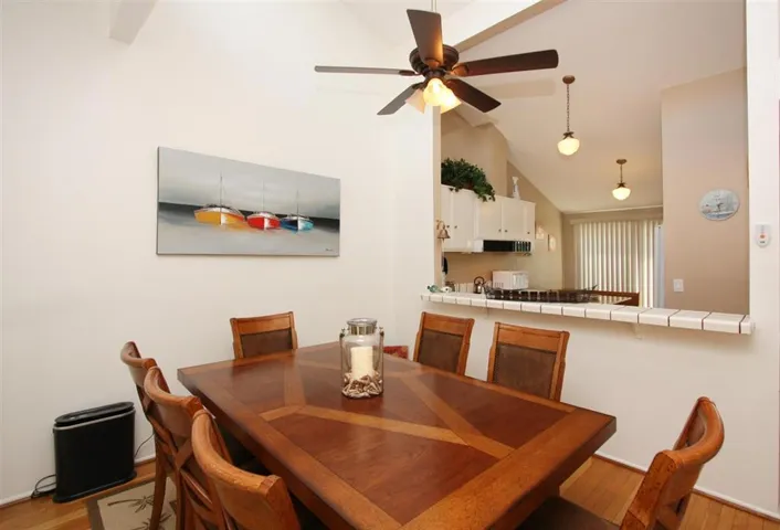 Dining area with ceiling fan.