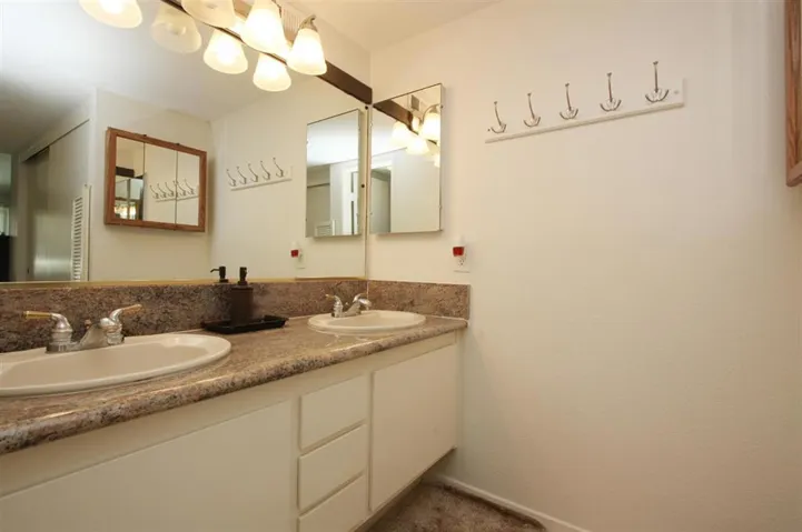 Master bathroom with granite counter tops and shower.