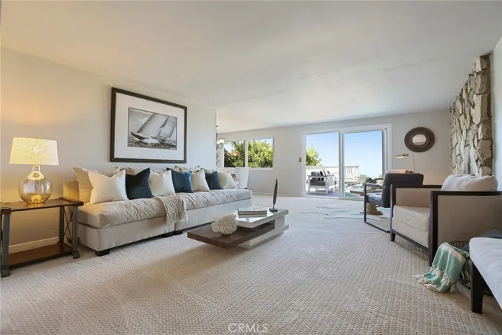 New carpet & paint in large living room that looks to the view