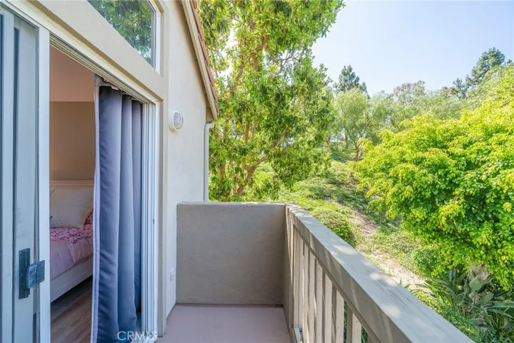 Balcony off Bedroom with view of greenbelt