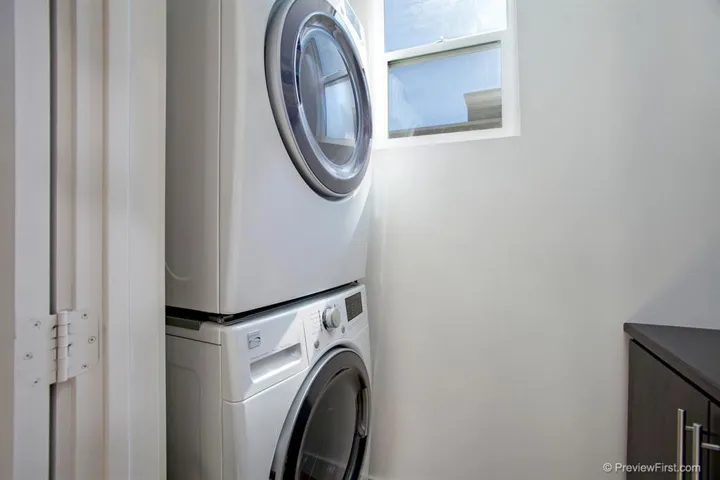 Full-sized, stackable washer and dryer.