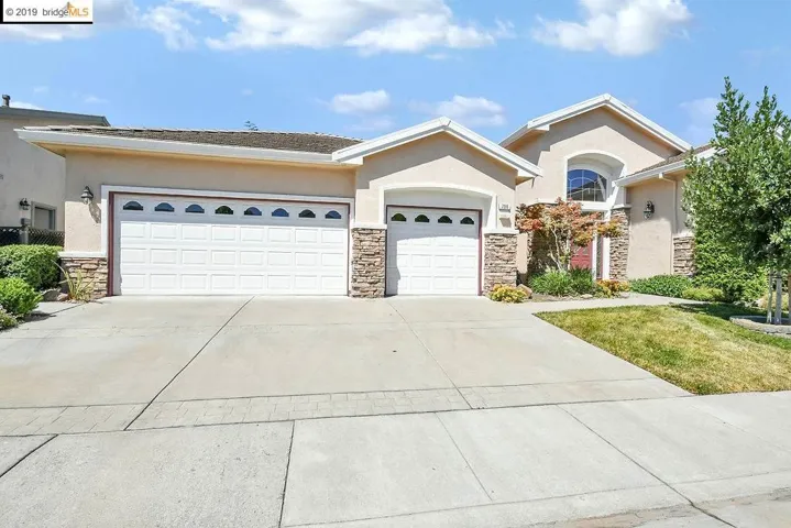 3 Car Garage with Storage Cabinets