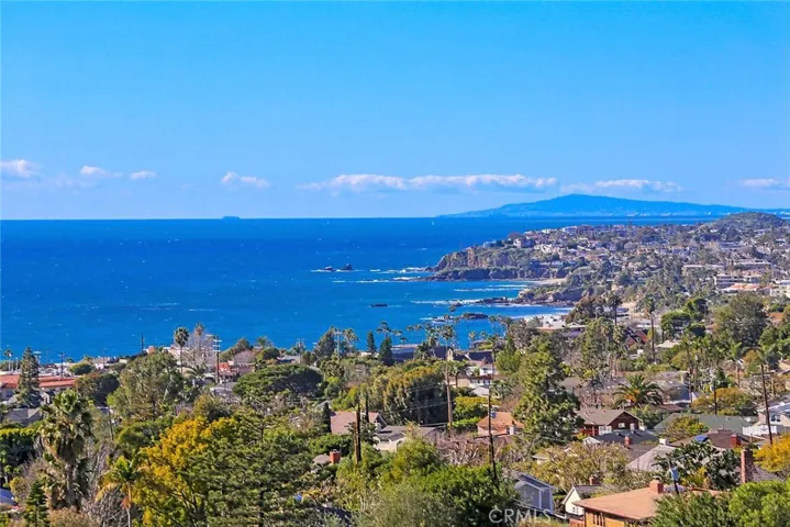 Incredible coastline and sunset views from most rooms of this immaculate custom home!