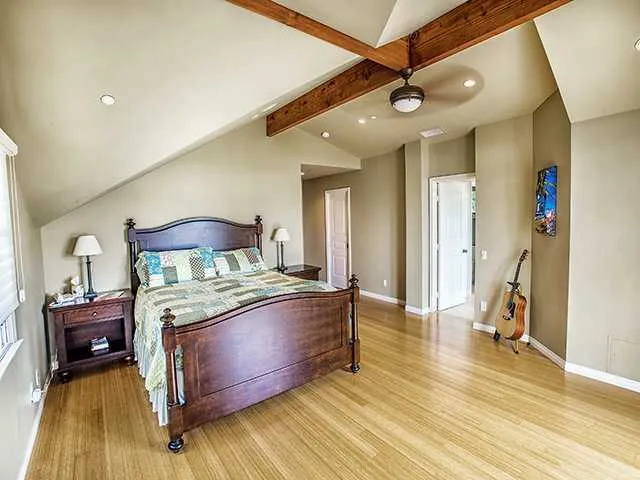 Master Bedroom with open beam vaulted ceilings and bamboo hardwood floor