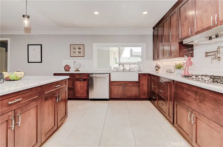 Alda wood cabinetry with soft-close hinges; granite counters; recessed lighting