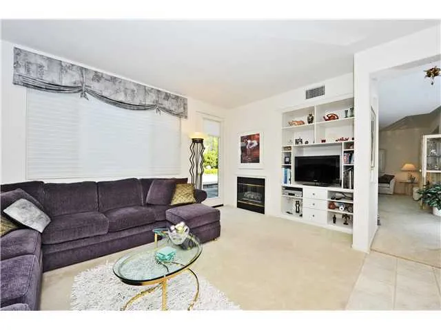 If you would remove the portion of the wall where the TV/Media Center is, it would open up the entire first floor making it into a GREAT ROOM!! This area would open up the entire rear of the home including kitchen to flow out th the back yard!
