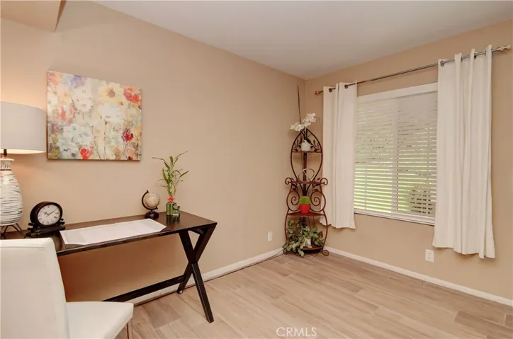 Downstairs, bedroom #3 functions super efficiently as the Home Office Hub.. and like most rooms has super views of "Green"!