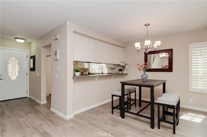 Wine, Homework, and Good Conversation happen at the 'BAR"! Take a look too at the high-end custom front door, another outstanding designer touch!