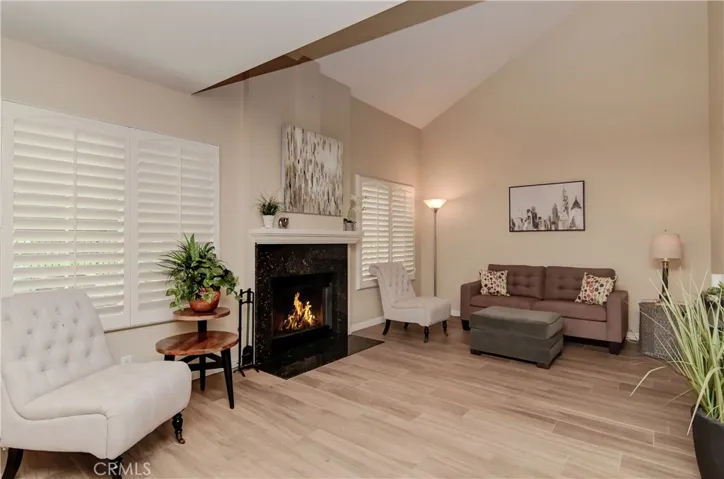 Volume ceilings Plantatation Shutters and Easy Care "Wood" Tile Floors create the Easy Breezy lifestyle everyone craves!