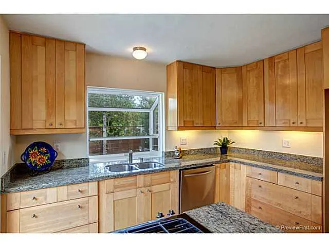 Beautiful Craftsman kitchen with quick access to the back yard for BBQ