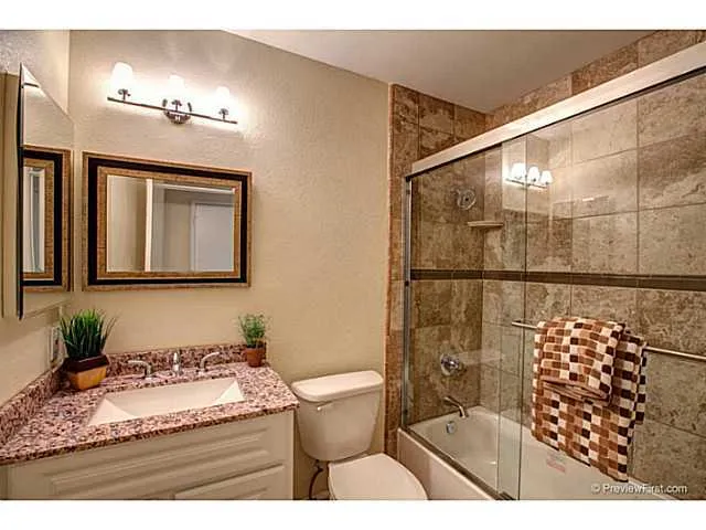 Hall bath remodeled w/ granite and glass enclosure