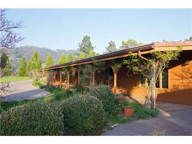 Comfortable ranch house nestled on 27 acres in the mountains on the edge of a scenic meadow.