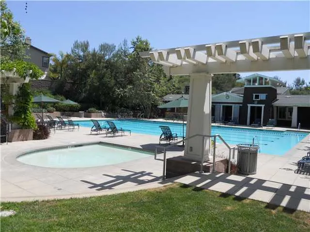 HOA La Costa Oaks Community Clubhouse with pool, tot pool, gym, kitchen, outdoor fireplace, and patio