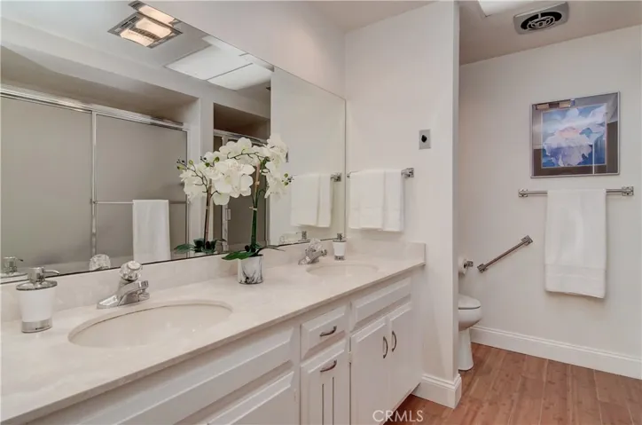 Solid surface counters are easy to clean...large vanity has plenty of storage.