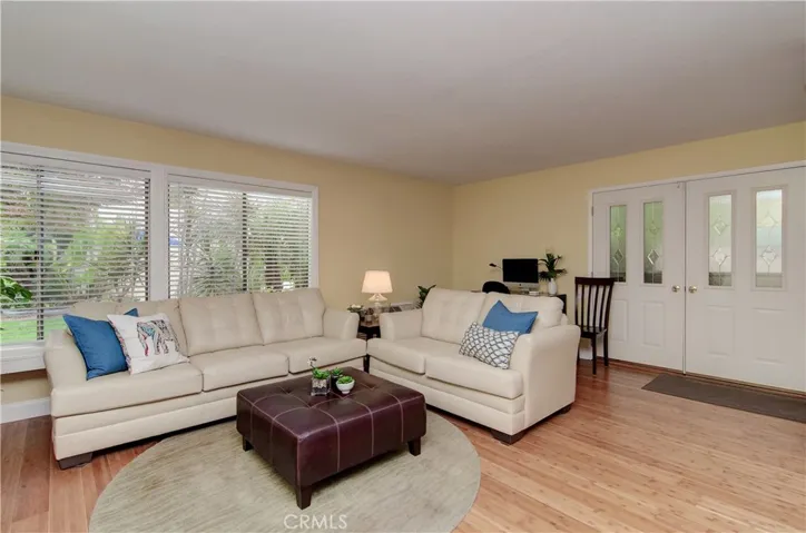 Plenty of  space for large furniture, computer/desk area and more...plus lovely views of outside greenery through large windows.