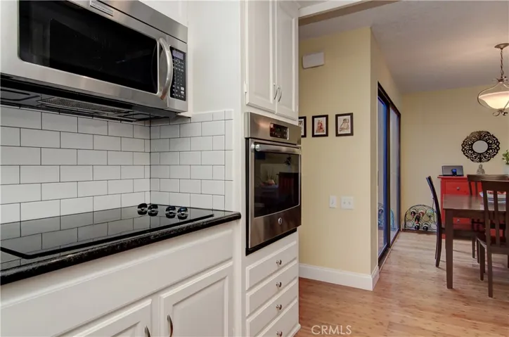 Smooth surface cook top, large wall oven and microwave will make any cook happy.