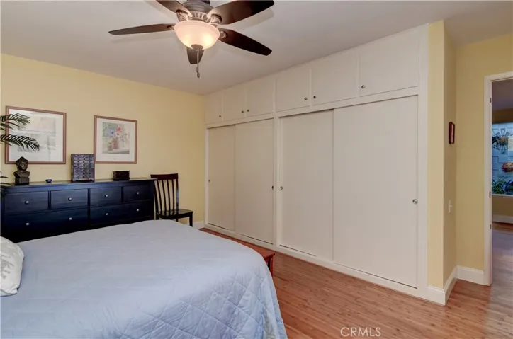 Lots of storage space in master bedroom with dual wardrobe closets and additional overhead storage.