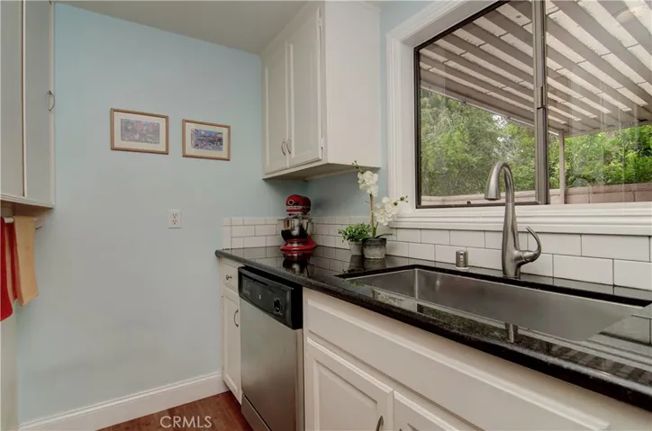 Love this window in the kitchen...check out the huge stainless sink, and stylish details and upgrades.