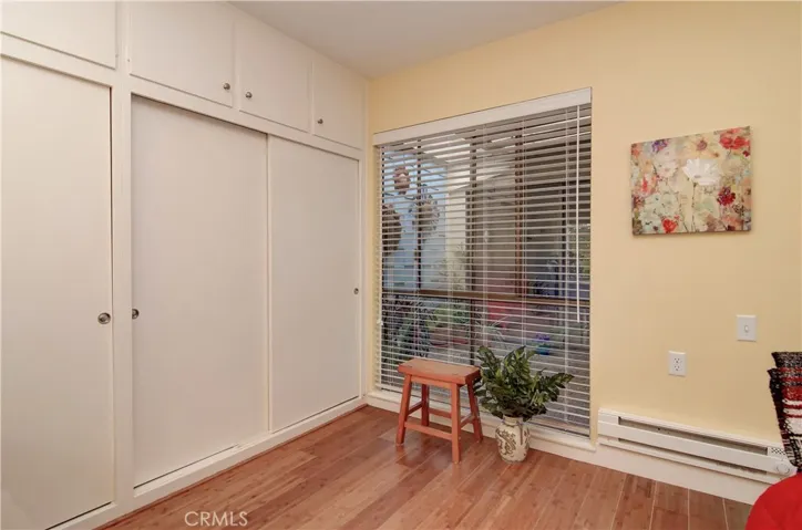 Second bedroom has large wardrobe closets and looks out to private enclosed atrium.