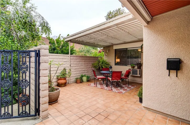 This spacious enclosed patio area has it all...sun, shade, privacy and plenty of room for outdoor entertaining.