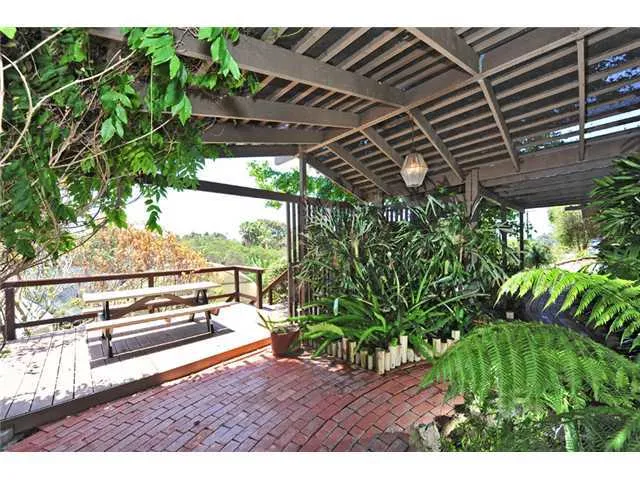 There is a deck with a view just off the tropical front entry