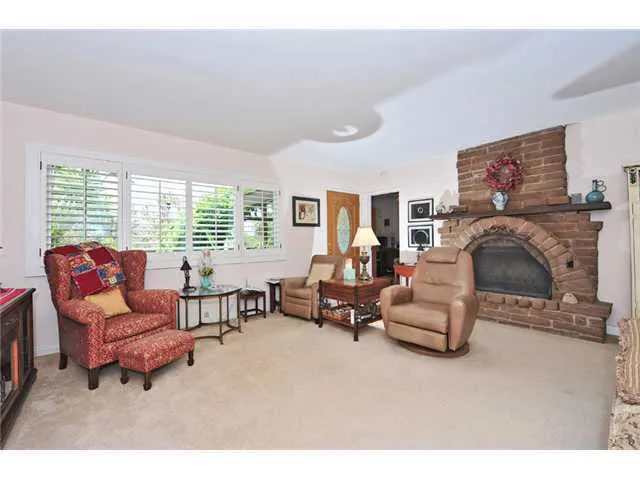 Large living room with charming brick fireplace