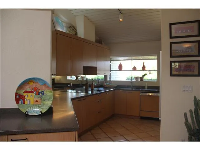 Newer kitchen with corian counter tops, Kitchen Aide appliances including glass cooktop, stainless steel oven and microwave.  Sub Zero refrigeraator, too!