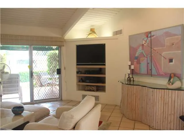 Living room facing built-in TV alcove.