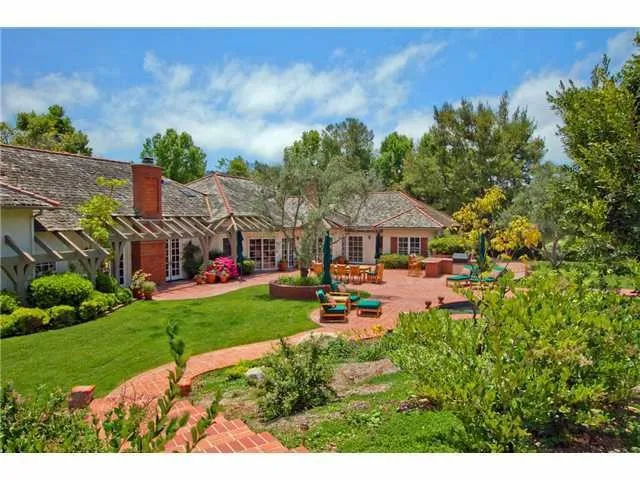 The magnificent grounds contain a granite bar & bar-be-cue, Pebble tech pool and spa, lawn areas, and a meandering path to the trees beyond.