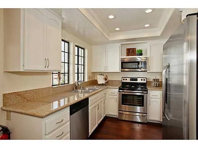 Kitchen w/ granite tops, wine cooler, frig conveys