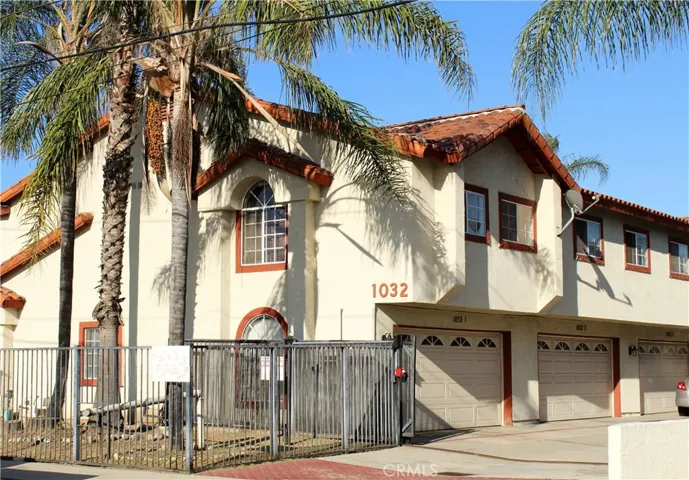 Front of Complex with fence and gate