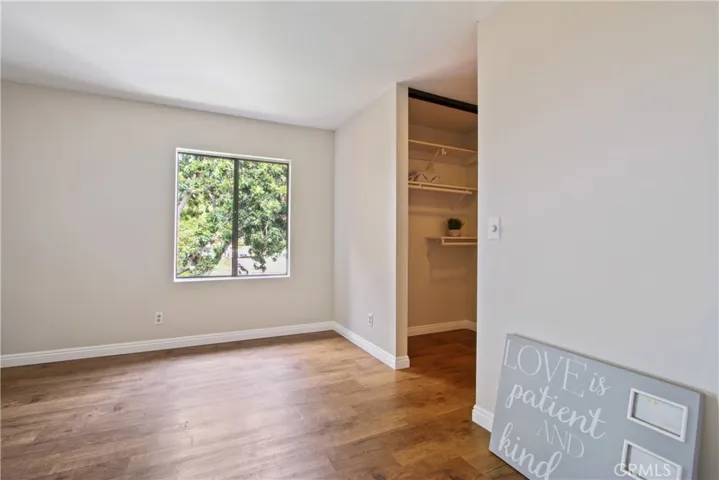 Master bedroom with his and her closets!