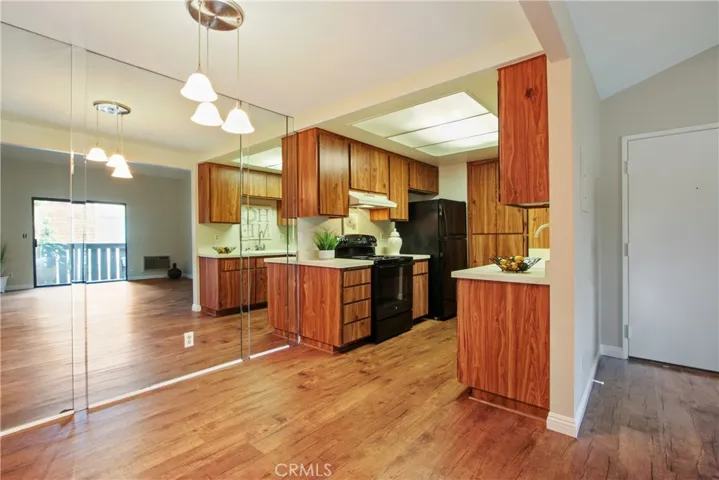 Notice the mirrored wall in the dining area!