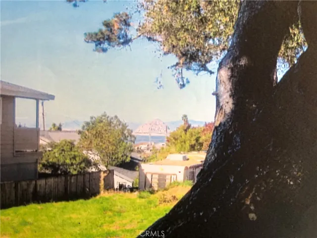 View from front of lot, looking towards the Bay. A new 2 story home presents the opportunity to provide many great views of Bay, Sandspit, Morro Rock and beyond! Close-by recreational activities, relaxation, entertainment, dining, etc., in Baywood Park! Lifestyle!!