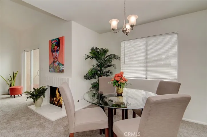 Separate dining space is just right...and enjoys views of patio and fireplace.
