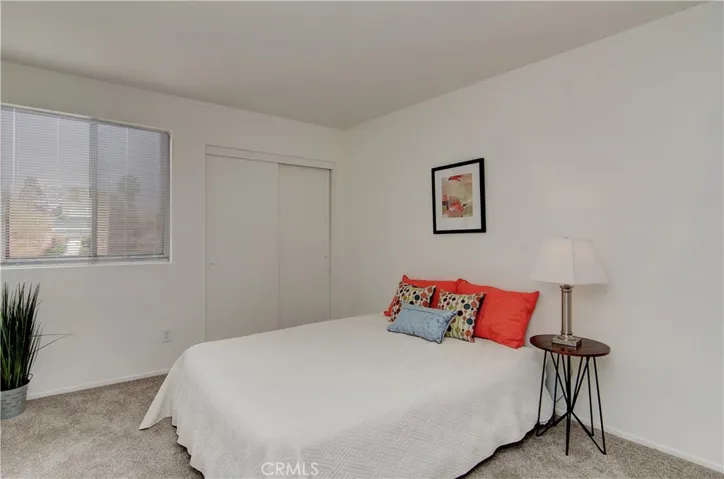 Roomy bedroom with large wardrobe closet.