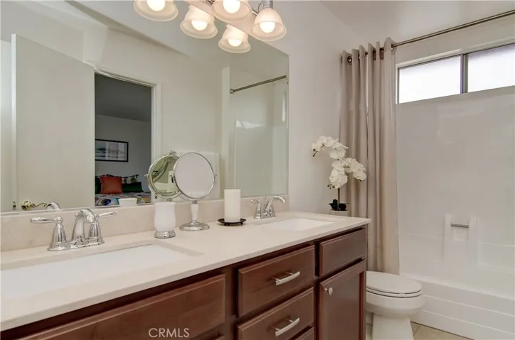 Gorgeous remodeled upstairs bath...dual vanity has plenty of storage.
