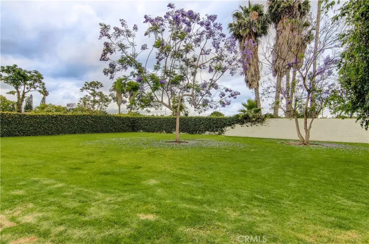 Small gated complex has lots of greenbelt areas.