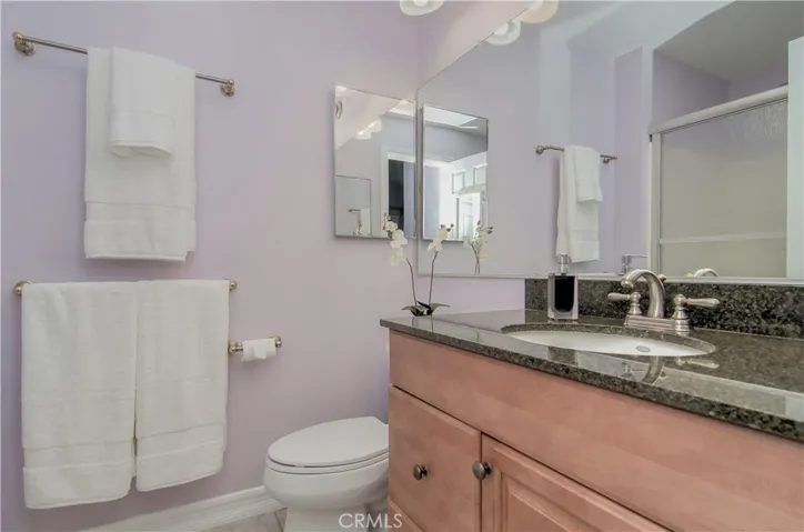 Master bath with extra towel bars for convenience. Beveled Granite counters keep clean up easy, breezy.