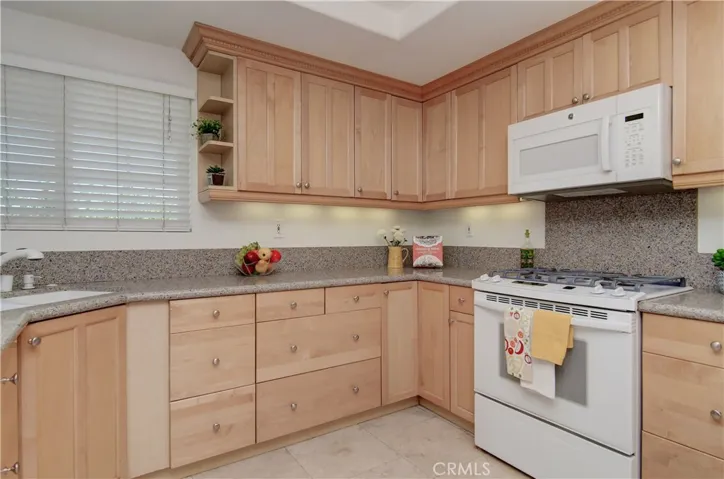 Soooooo much storage space here, and a window at the sink!