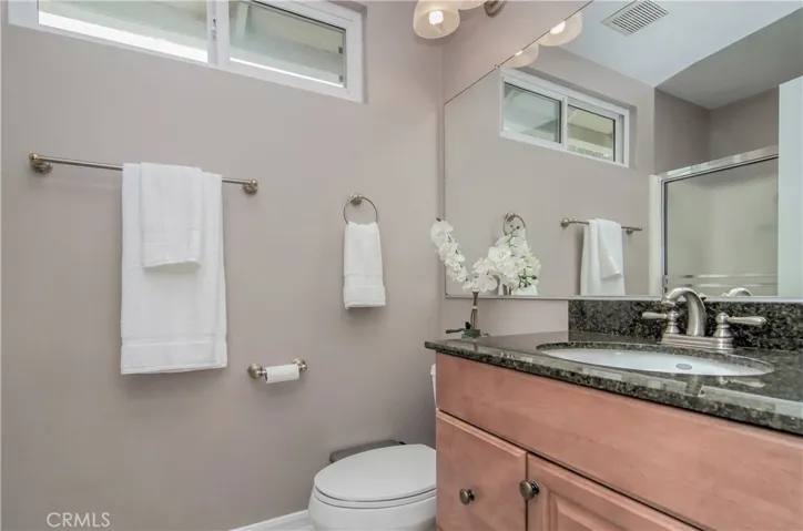 Upstairs hall bath with extra wide mirror.