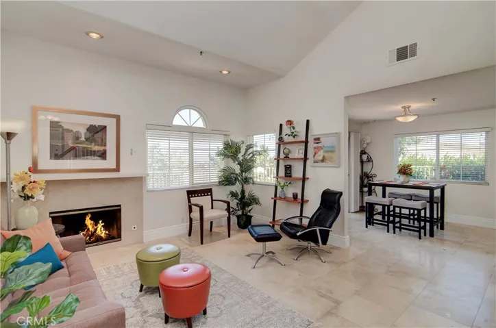 This end unit has it all...vaulted ceilings, fireplace and awesome natural light from windows everywhere!