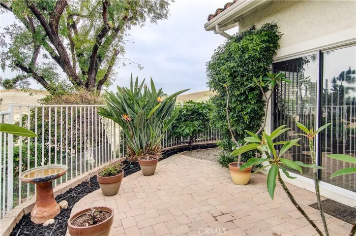 Nice brick terrace and planter areas offer entertaining and gardening options.