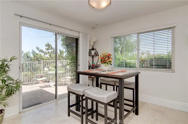 Roomy dining space has slider for easy flow inside and out...and views all around...