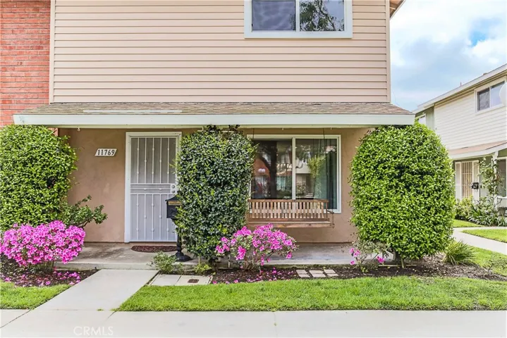 Nice end unit, with a front porch and swing