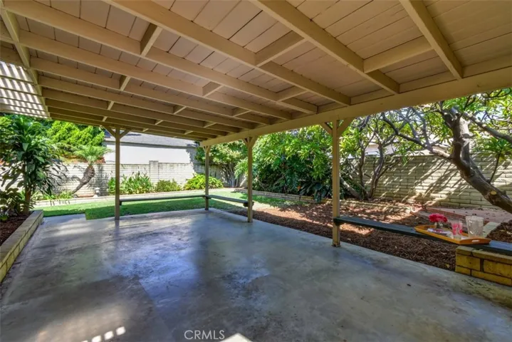 Living room, dining area and kitchen view the spacious covered patio area.  Terrific for entertaining, al fresco dining, or just relaxing in your backyard.
