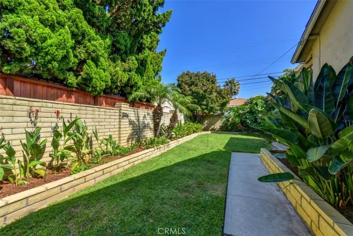 View of side yard from the family room door.  Great space for gardening.