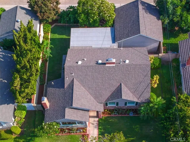 Arial view of the house.  Detached 2-car garage faces the alley and is accessible through the covered patio.