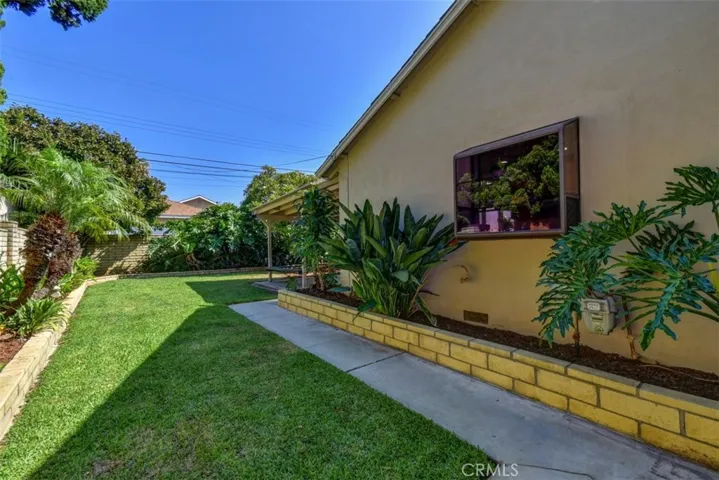 View of side yard from the gate.  Great space for gardening.